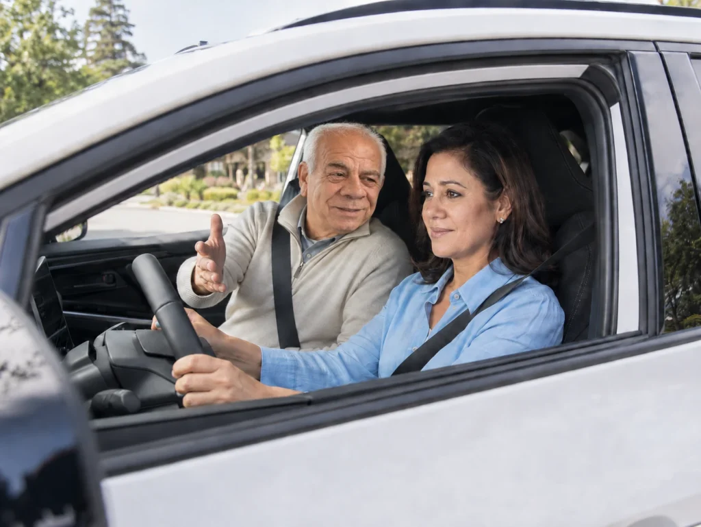 Driving instructor and student inside a car